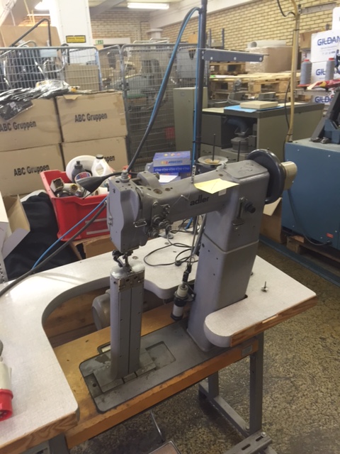 ADLER Kl. 68-4272 two needle high post bed sewing machine with triple transport, complete on table with electronic motor