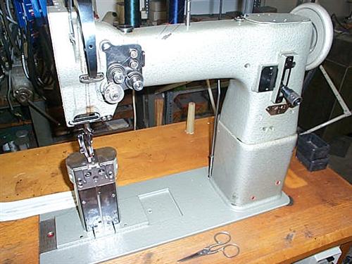 PFAFF Kl. 194-944/01 two needle post bed sewing machine with drop feed, complete on table
