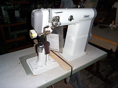 PFAFF Kl. 474-755/01-725/04 two needle flat post bed sewing machine with wheel feed, needle feed and driven roller presser, thread trimmer, complete with table and electronic motor with extra driven trimming device from below