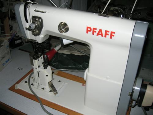 PFAFF Kl. 471-755/01-725/04 single needle flat post bed sewing machine with wheel feed, needle feed and driven roller presser, left standing post, complete with table and electronic motor with extra driven trimming device from below