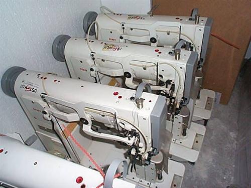 PFAFF Kl. 294-750/01 two needle post bed sewing machine with drop feed, driven roller presser, complete on table