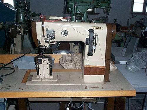 PFAFF Kl. 294-720/02 two needle post bed sewing machine with drop feed, disengageable needle bar, thread trimmer, complete on table with electronic motor